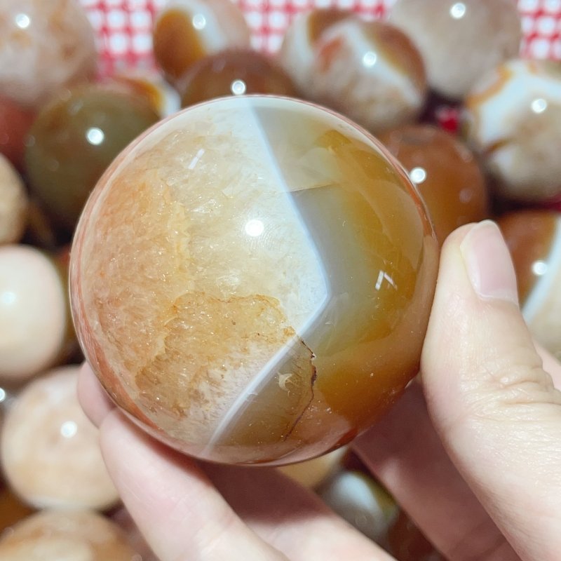 1.5 - 2.7in Carnelian Mixed Quartz Stripe Spheres Wholesale - Wholesale Crystals