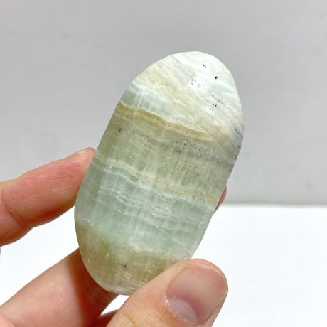 Green Calcite Palm Stone Wholesale Closeout - Wholesale Crystals